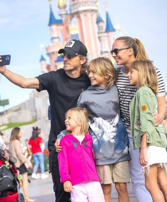 Luka Modric, his wife Vanja Bosnić, and his children enjoy Disneyland