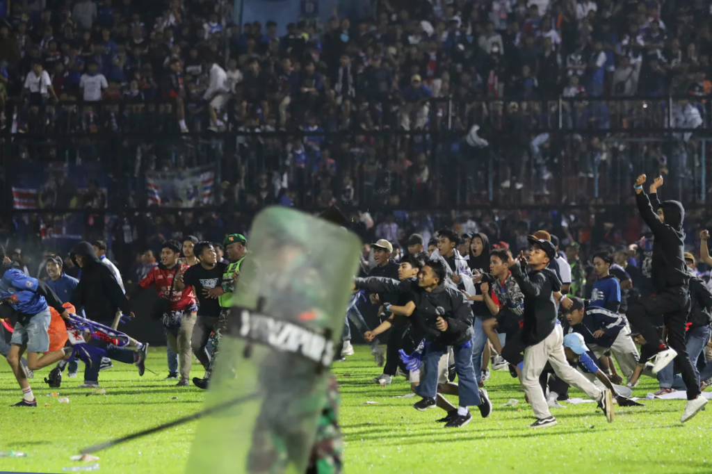 Six people have been charged with crimes in connection with the stadium crush in Indonesia