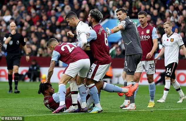 Cristiano Ronaldo wrestles Tyrone Mings during Aston Villa's 3-1 victory