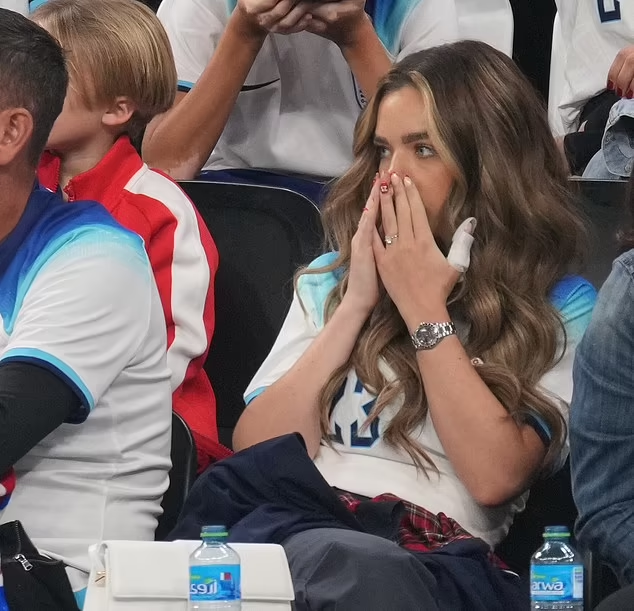 Weeping WAGs wipe away their tears as they console their heartbroken England following their 1-2 World Cup defeat to France
