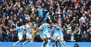 Manchester City players celebrating in their last encounter against Liverpool
