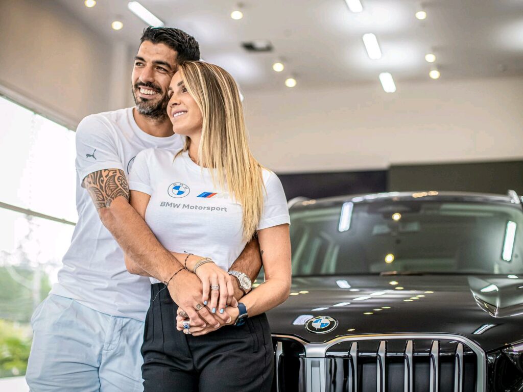 Luis Suarez and Sofia Balbi in front of their BMW X1