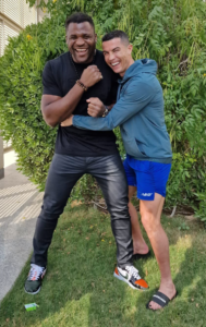 Cristiano Ronaldo with his black painted toenails in a picture alongside Francis Ngannou 