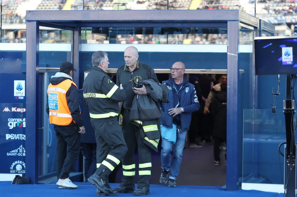 Firefighters at work before the commencement of the Empoli V Lecce match