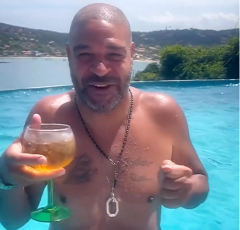 Adriano Shows He's Living His Best Life As He Belly Dances Topless In Pool