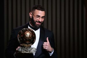 Karim Benzema holding his Ballon D'or award